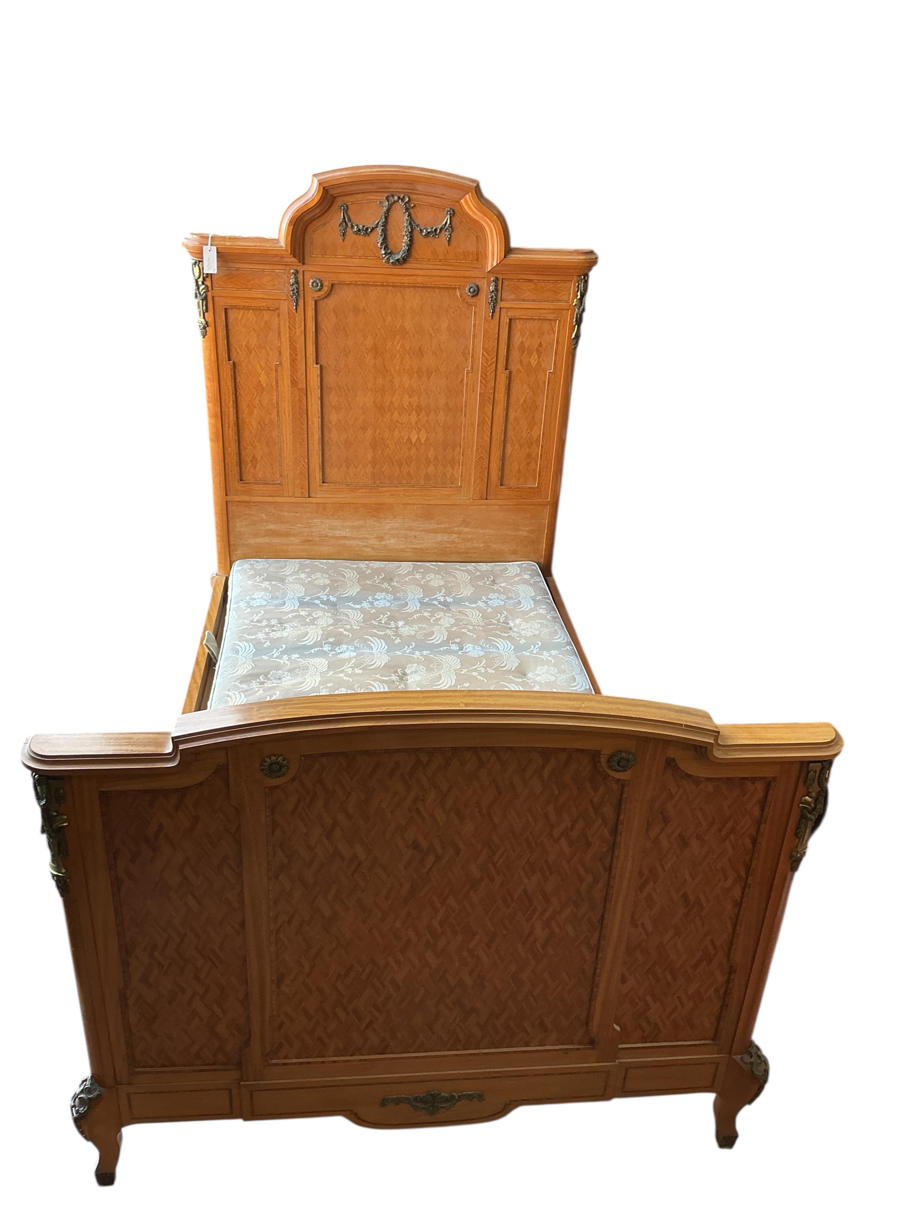 A pair of early 20th century French transitional style gilt metal mounted parquetry inlaid 4ft. bedframes, height 150cm